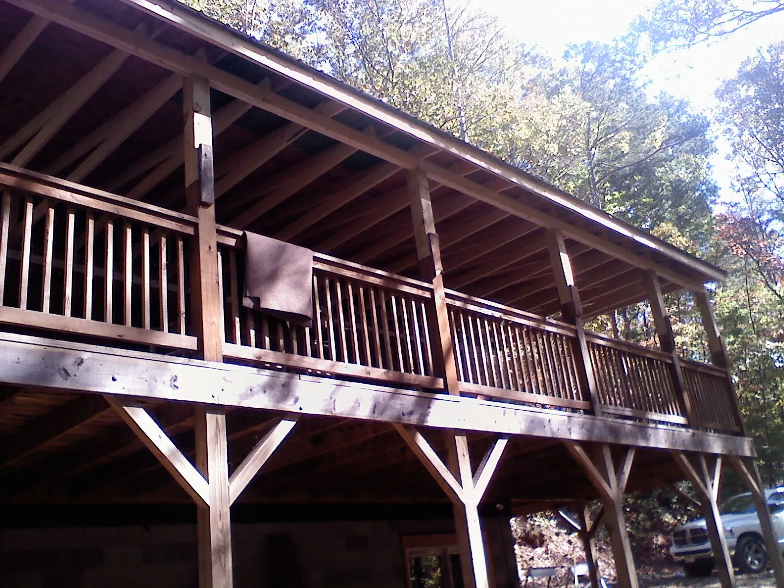 Timber framing under a new elevated porch and deck — Roof Leak Repair in Great Neck by Roofing Brothers